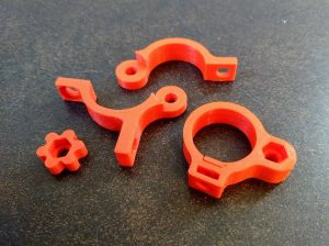 3D printed pieces for mounting a flashlight on bike handlebars embedded